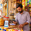 Indian Kirana Shopkeeper Checking Payment