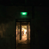 Green Exit Sign Glows