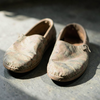 Worn Walking Shoes Await