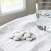 White Tablets Beside Water