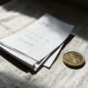 Documents and Brass Coin
