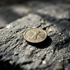 Ancient Brass Coin's Shadow