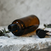 Amber bottle on stone