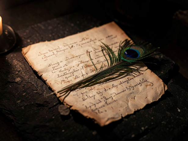 Ancient Manuscript and Feather