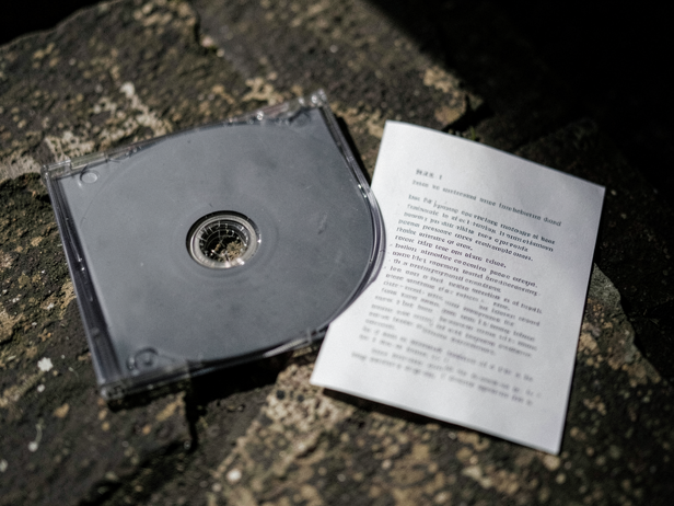 Shadowed CD Case and Paper