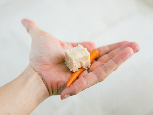 Hand with Chicken and Carrot