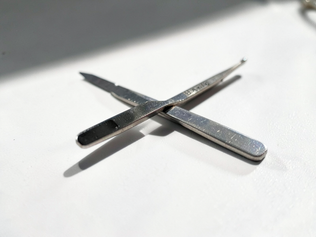 Surgical Retractor on White