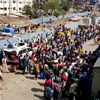 Watch: Hundreds of migrant workers gather outside Bandra Terminus ...