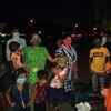 Stranded migrant workers await their turn to reach home